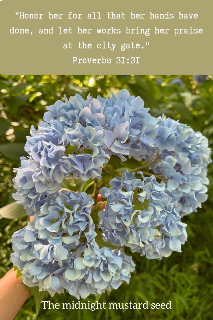 A bouquet of blue hydrangeas and the Bible verse proverbs 31:31