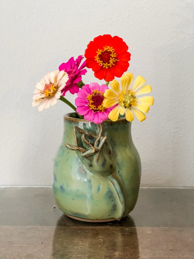 Jade Ceramic vase with hand sculpted tulip flower  on it with zinnia bouquet by artist Samm Stafford 
