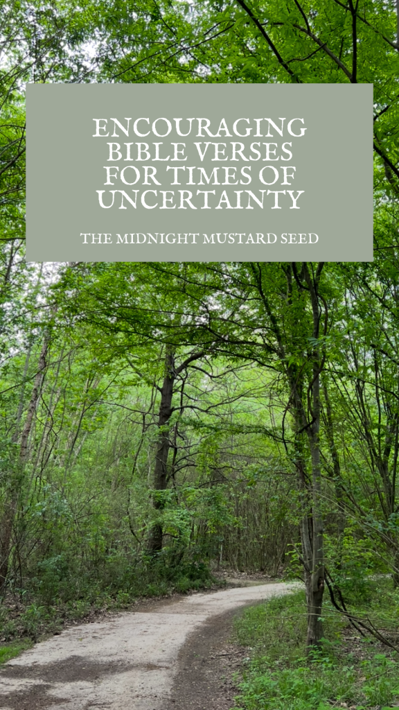 A serene forest path winds through lush green trees and foliage, with sunlight filtering through the canopy. At the top of the image, a rectangular overlay with a muted green background contains white text that reads, “ENCOURAGING BIBLE VERSES FOR TIMES OF UNCERTAINTY” in large letters, followed by “THE MIDNIGHT MUSTARD SEED” in smaller text below. The natural setting evokes a sense of peace and reflection, complementing the theme of the message.